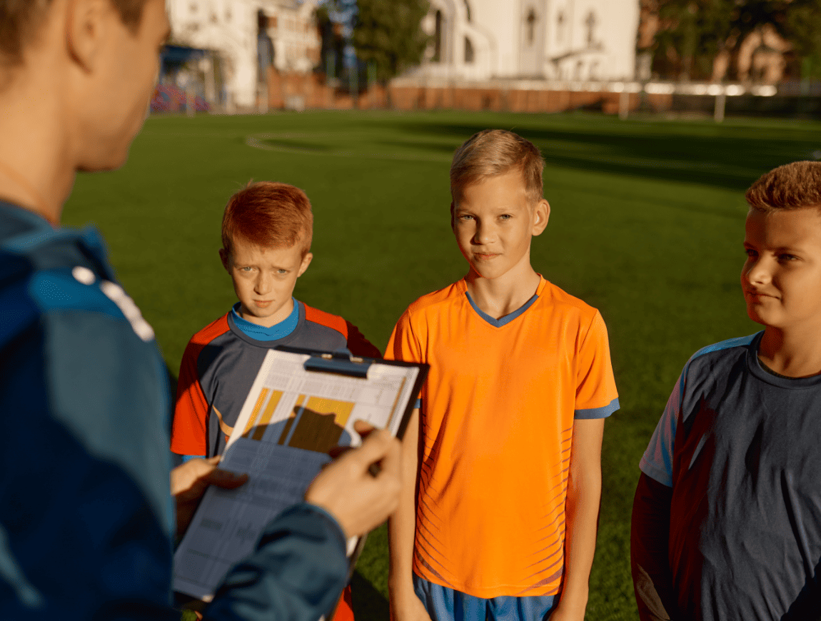 football-trainer-talking-to-team-of-little-players-2026-01-06-09-06-35-utc