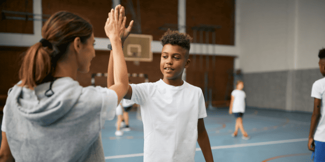 happy-african-american-schoolboy-giving-high-five-2026-01-07-00-41-43-utc