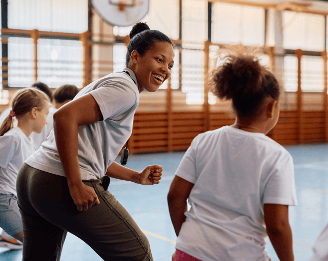 happy-pe-teacher-having-fun-while-racing-with-her-2026-01-08-08-11-16-utc