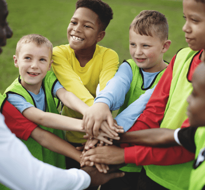 junior-football-team-stacking-hands-before-a-match-2026-01-08-00-05-11-utc